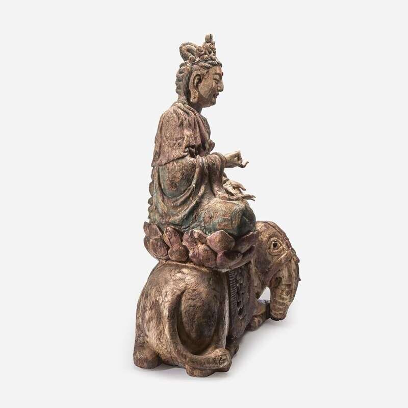A large carved and polychromed wood figure of the