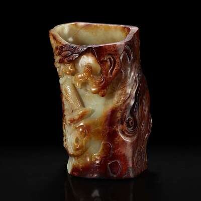 A Chinese carved russet and celadon jade brush holder 青玉