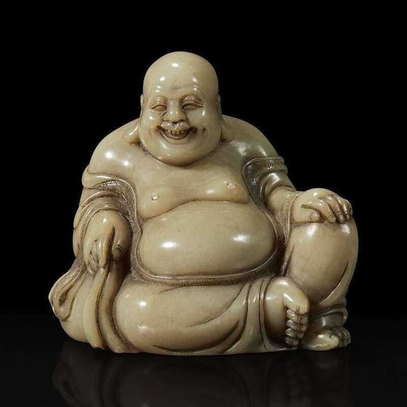 A Chinese carved soapstone figure of a seated Budai 寿山石雕布袋和尚Lot 57