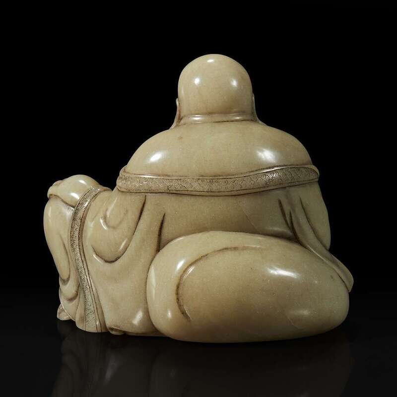 A Chinese carved soapstone figure of a seated Budai 寿山石雕布袋和尚Lot 57