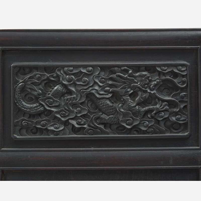 A Chinese carved hardwood six-panel “Dragons” screen 硬木浮雕龙纹