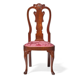 A Queen Anne Carved Walnut Compass-Seat Side Chair