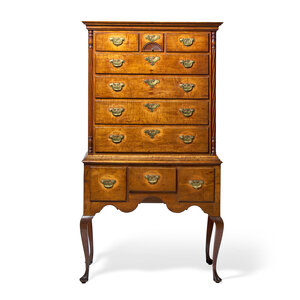 A Queen Anne Carved Figured Maple and Birch Flat-Top High Chest of Drawers