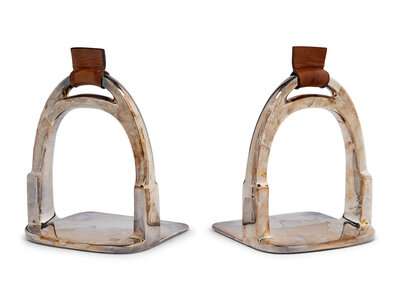 A Pair of Ralph Lauren Silver-Plate and Leather Stirrup-Form Bookends ...